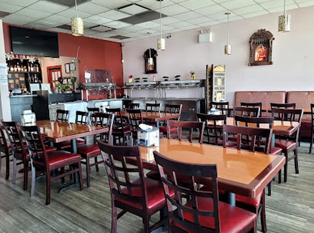 Spacious dining room and buffet counter at Dawat India Restaurant in Regina, SK
