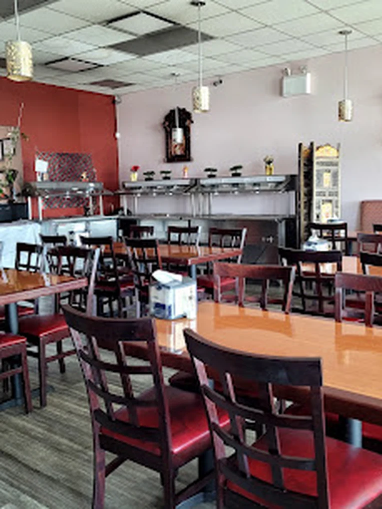 Dining room set for dine-in service at Dawat India Restaurant, Regina
